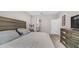 Cozy bedroom featuring neutral walls, soft carpet, and views of the adjacent bathroom at 2822 E Hidalgo Ave, Phoenix, AZ 85040