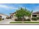Charming single-story home with well-maintained landscaping, a lush tree, and inviting curb appeal at 2822 E Hidalgo Ave, Phoenix, AZ 85040