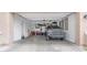 View of open two car garage with ample storage and a parked grey Toyota truck at 2822 E Hidalgo Ave, Phoenix, AZ 85040