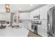 Bright kitchen featuring white cabinets, stainless steel appliances, and a spacious island at 2822 E Hidalgo Ave, Phoenix, AZ 85040