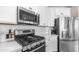Close-up of a well-equipped kitchen featuring stainless steel appliances and modern design at 2822 E Hidalgo Ave, Phoenix, AZ 85040