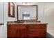 Bathroom featuring a dark wood vanity, granite counters and a large mirror at 2906 W Irma Ln, Phoenix, AZ 85027
