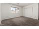 Bedroom with neutral carpet, white walls and closet at 2906 W Irma Ln, Phoenix, AZ 85027