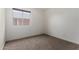 Bright bedroom features a window and neutral carpet, creating a tranquil space at 2906 W Irma Ln, Phoenix, AZ 85027