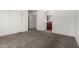 Bedroom with neutral carpet, closet and view to the bathroom at 2906 W Irma Ln, Phoenix, AZ 85027