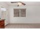 Bright dining area with tile floors, white walls, ceiling fan and natural light at 2906 W Irma Ln, Phoenix, AZ 85027