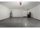 Large garage with epoxy floors, water softener, and water heater, providing convenience at 2906 W Irma Ln, Phoenix, AZ 85027