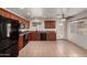 Spacious kitchen featuring classic style with dark cabinets, tile floors and black appliances at 2906 W Irma Ln, Phoenix, AZ 85027