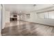 Spacious living room showcasing hardwood flooring, neutral walls, and backyard views at 2906 W Irma Ln, Phoenix, AZ 85027