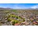 Expansive aerial view of a vibrant residential community with mountain views and green spaces at 2909 W Bowker St, Phoenix, AZ 85041