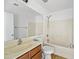 Bright bathroom with vanity, mirror, toilet, and tub/shower combo at 2909 W Bowker St, Phoenix, AZ 85041