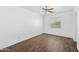 This bedroom offers beautiful wood-look tile floors and a ceiling fan at 2909 W Bowker St, Phoenix, AZ 85041