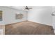 Serene bedroom featuring neutral carpet, ceiling fan, and natural light at 2909 W Bowker St, Phoenix, AZ 85041