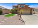 A two-story suburban residence with desert landscaping and a paved driveway at 2909 W Bowker St, Phoenix, AZ 85041
