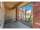 Covered front porch with tile flooring and brick support columns at 2909 W Bowker St, Phoenix, AZ 85041