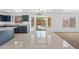 Open kitchen and dining area leading to the backyard and featuring sleek cabinetry at 2909 W Bowker St, Phoenix, AZ 85041