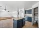 Open kitchen featuring a central island, tile floors, and seamless flow to living spaces at 2909 W Bowker St, Phoenix, AZ 85041