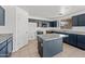 Well-equipped kitchen featuring ample storage, an island, and granite countertops at 2909 W Bowker St, Phoenix, AZ 85041