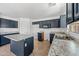 Bright kitchen with granite countertops, an island, and plenty of storage space at 2909 W Bowker St, Phoenix, AZ 85041