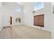 Bright, open-concept living area with carpet, tile and abundant natural light at 2909 W Bowker St, Phoenix, AZ 85041