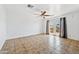 Bright, open living area featuring neutral tile floor, ceiling fan and door to back porch at 2909 W Bowker St, Phoenix, AZ 85041