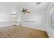 Spacious living room featuring a ceiling fan and stairway at 2909 W Bowker St, Phoenix, AZ 85041