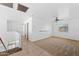 Spacious living room with neutral carpet, ceiling fan and bright natural light at 2909 W Bowker St, Phoenix, AZ 85041