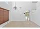 Spacious living area with high ceiling, neutral tones, and arched doorway at 2909 W Bowker St, Phoenix, AZ 85041
