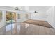 Bright living room with sliding glass door, neutral tones, and tiled floor at 2909 W Bowker St, Phoenix, AZ 85041