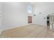 Spacious living room with high ceilings, carpeted floors, and abundant natural light at 2909 W Bowker St, Phoenix, AZ 85041