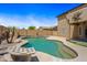 Relaxing pool with a built-in table feature and mature palms at 2909 W Bowker St, Phoenix, AZ 85041