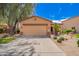 Charming single-story home features a two-car garage and professionally landscaped front yard at 30266 N Royal Oak Way, San Tan Valley, AZ 85143