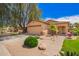 Charming single-story home features a two-car garage and professionally landscaped front yard at 30266 N Royal Oak Way, San Tan Valley, AZ 85143
