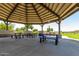 A covered picnic area in community park with lake view at 30266 N Royal Oak Way, San Tan Valley, AZ 85143