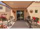 Covered patio with neutral furniture, decor, and sliding glass doors to the backyard at 30266 N Royal Oak Way, San Tan Valley, AZ 85143