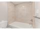 Tiled bathroom with shower-tub combination, light fixtures and towel bar at 3119 W Cochise Dr # 111, Phoenix, AZ 85051