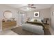 Stylishly decorated bedroom featuring a ceiling fan and sliding glass doors at 3119 W Cochise Dr # 111, Phoenix, AZ 85051