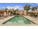 Community pool with lounge chairs and well maintained landscaping at 3119 W Cochise Dr # 111, Phoenix, AZ 85051