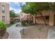 Exterior building view showing grassy area, walkways and exterior staircase at 3119 W Cochise Dr # 111, Phoenix, AZ 85051