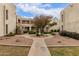 Charming courtyard with mature landscaping and walkways leading to each building, providing a tranquil outdoor space at 3119 W Cochise Dr # 111, Phoenix, AZ 85051