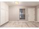 Bright dining room with white cabinets, wood-look flooring, and natural light at 3119 W Cochise Dr # 111, Phoenix, AZ 85051
