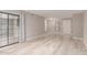 Modern living room with laminate floors, neutral walls, and sliding glass door, perfect for entertaining at 3119 W Cochise Dr # 111, Phoenix, AZ 85051