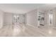 Open-concept living room with laminate floors, neutral walls, and direct access to the kitchen at 3119 W Cochise Dr # 111, Phoenix, AZ 85051