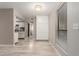 Open living space with white storage cabinets and a view of the kitchen at 3119 W Cochise Dr # 111, Phoenix, AZ 85051