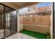 Quaint patio with turf section and sliding glass doors at 3119 W Cochise Dr # 111, Phoenix, AZ 85051