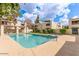 Community swimming pool surrounded by well-maintained landscaping at 3119 W Cochise Dr # 111, Phoenix, AZ 85051