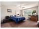 Comfortable bedroom featuring a cozy bed, a window, and neutral décor at 3237 W Angela Dr, Phoenix, AZ 85053