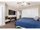 This bedroom features carpet and neutral walls, and a ceiling fan for comfort at 3237 W Angela Dr, Phoenix, AZ 85053