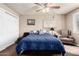 Bright bedroom boasts a cozy bed and neutral colored walls with decorative art at 3237 W Angela Dr, Phoenix, AZ 85053