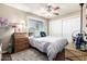 This cozy bedroom offers a window view and a ceiling fan for extra comfort at 3237 W Angela Dr, Phoenix, AZ 85053